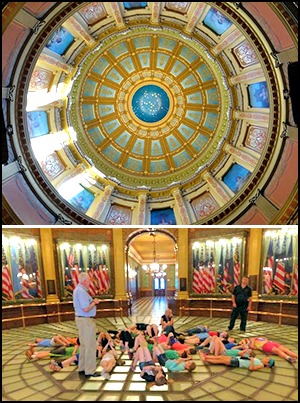 School children view the oculus and inner dome from the Michigan Capitol rotunda's glass floor